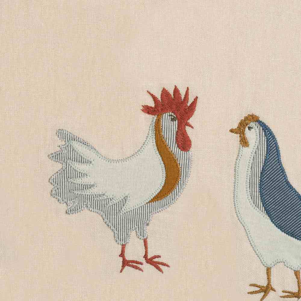 Milkbarn Kids Applique Detail of the Chicken Applique on the Organic Linen Bibs