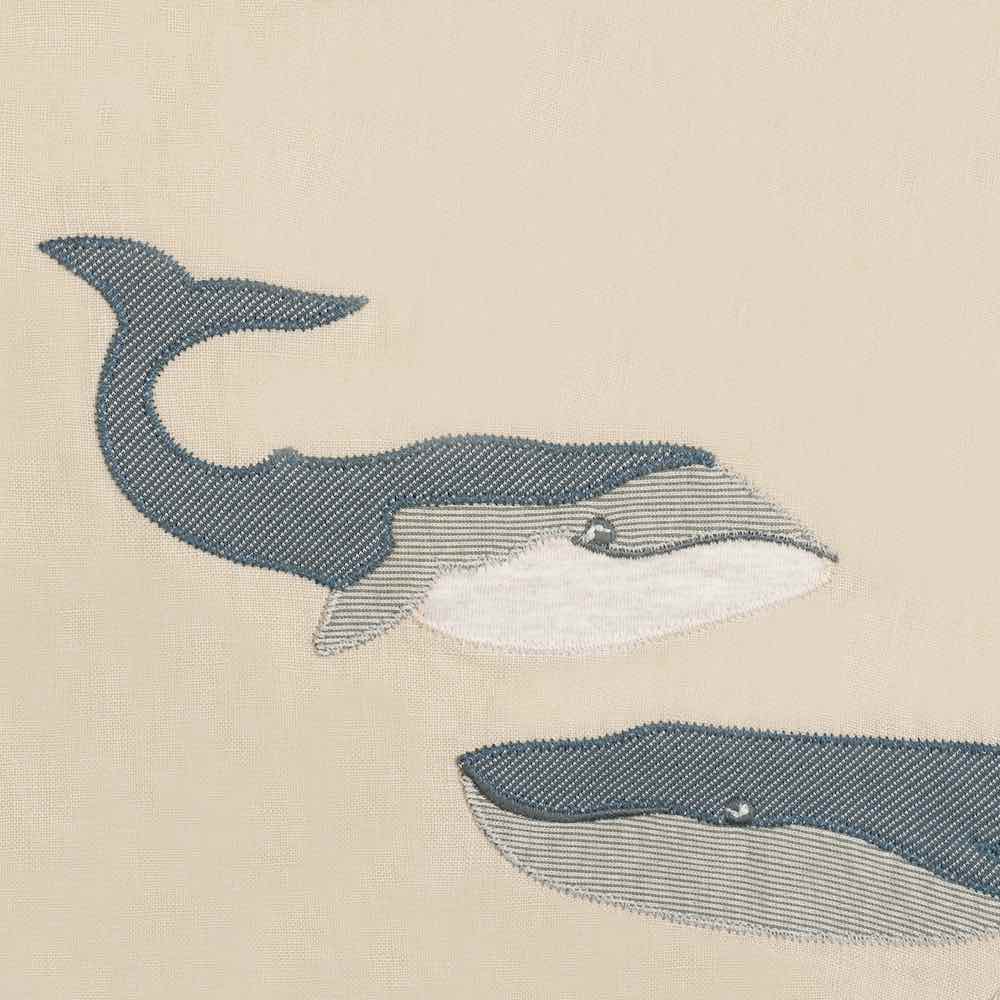 Milkbarn Kids Applique Detail of the whale applique on the organic Linen Bib