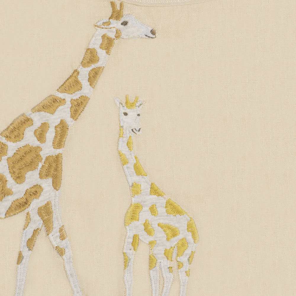 Milkbarn Kids Applique Detail of the Giraffe Applique on the organic Linen Bib