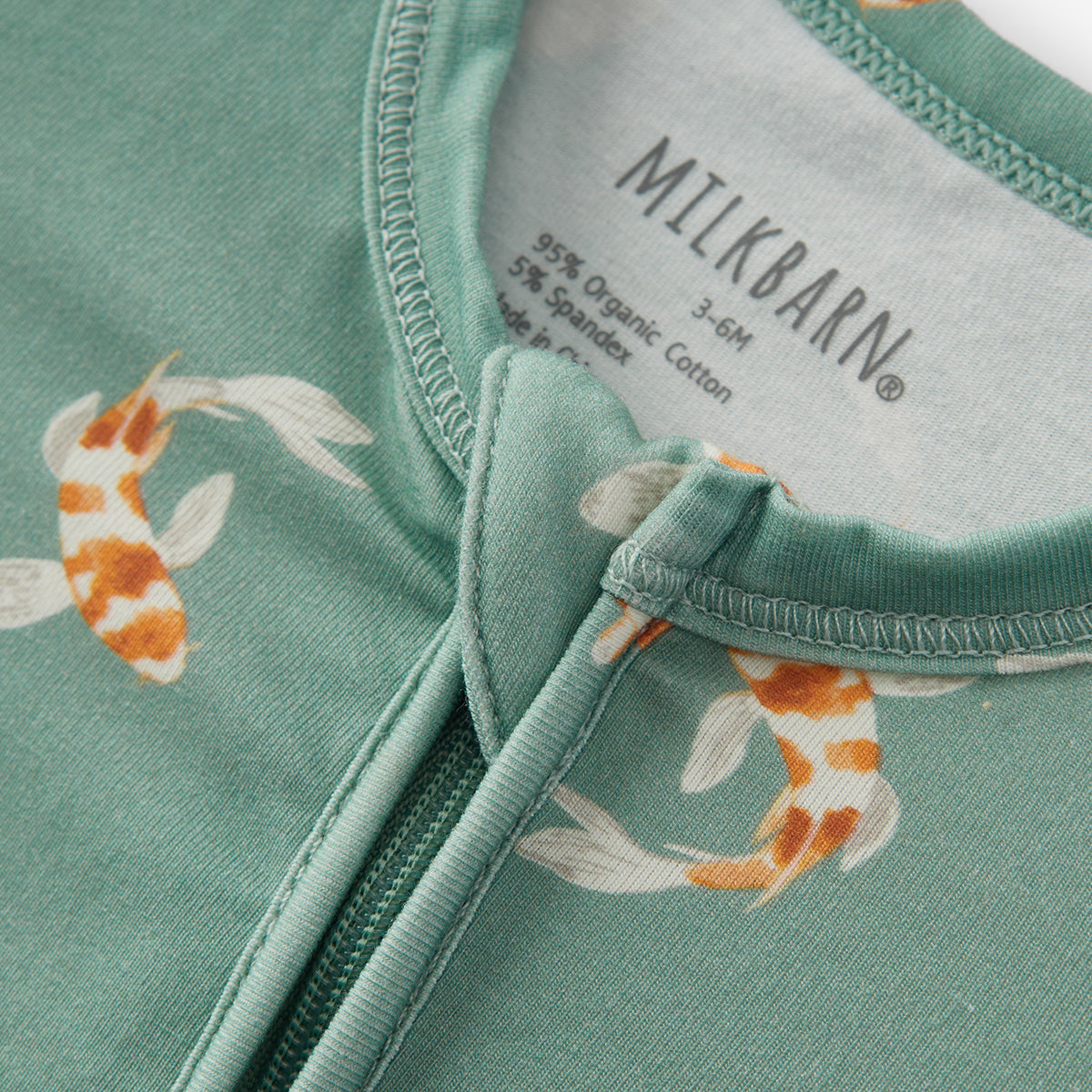 swimming koi cotton stretch zipper footed romper