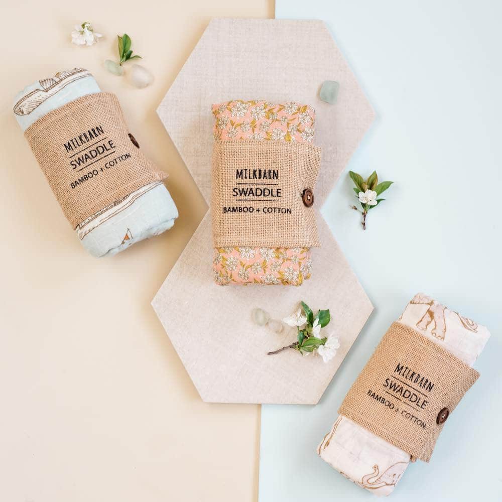 Packaging display of the Milkbarn Kids Bamboo baby and newborn Swaddle blankets.