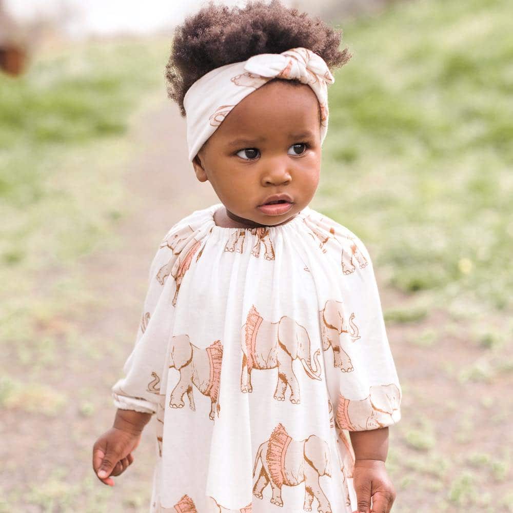 Little baby girl wearing Milkbarn kids knotted Headband In Bamboo Tutu Elephant