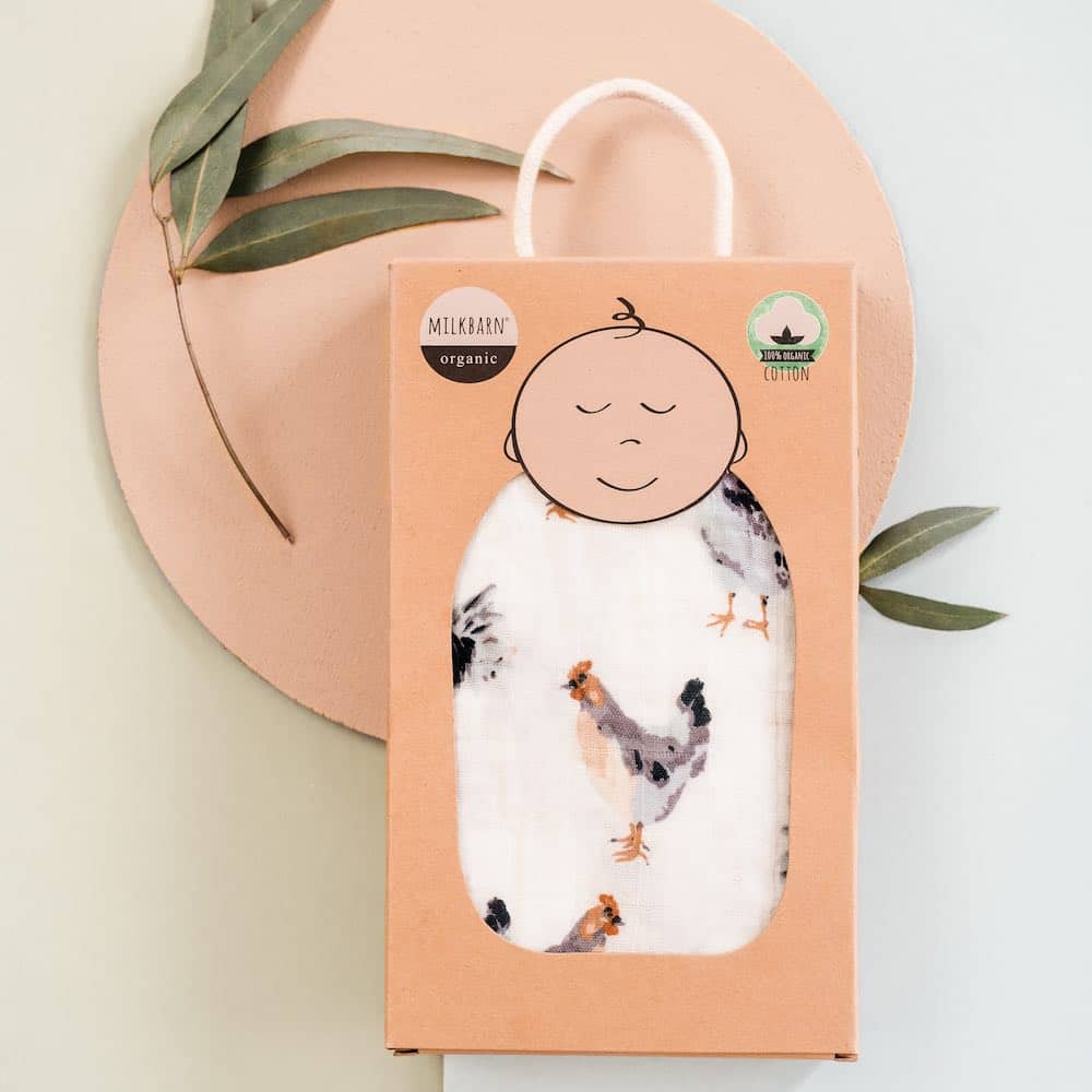 Packaging display of the Milkbarn Kids Organic baby and newborn Swaddle