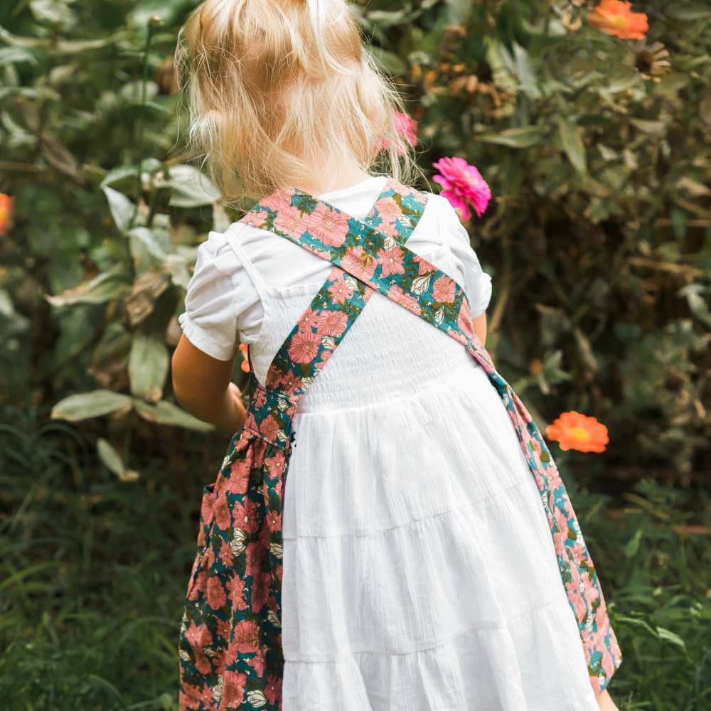 Little Girl in a Garden in a Pinafore Apron by Milkbarn Kids Back Detail