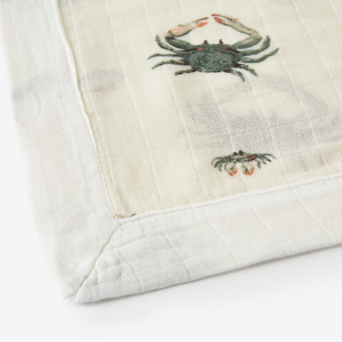 Closeup of Coastal Crab Mini Lovey muslin crab fabric detail