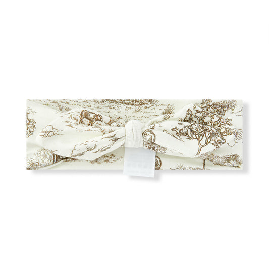 Baby girl luxe stretch knotted bow headband, white fabric with intricate countryside cow print