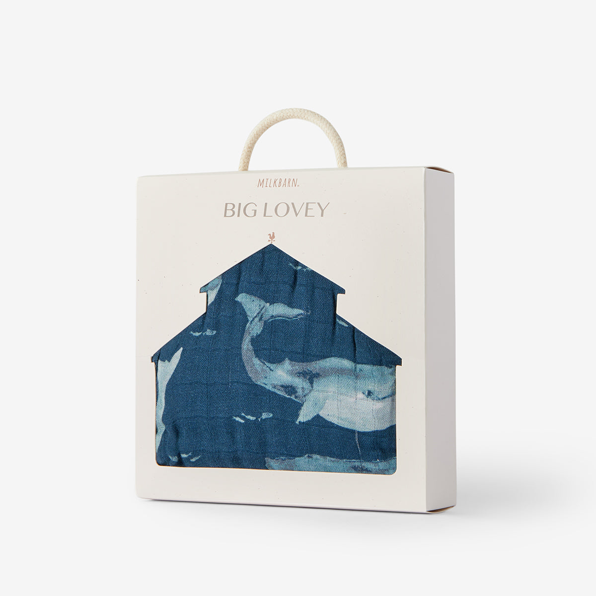 Milkbarn Blue Whale Big Lovey blanket shown folded inside branded packaging, featuring dark blue fabric and matching trim