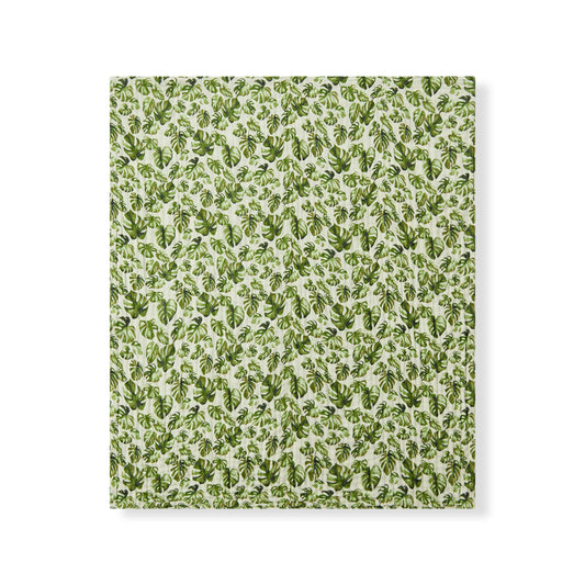 Milkbarn Island Leaf organic cotton baby towel with tropical leaf design, cozy and gentle for beach days or bedtime baths.