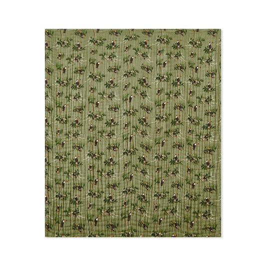 Milkbarn Toucan cotton baby towel with bright tropical toucans on a dark green base, perfect for poolside fun and everyday bath routines.