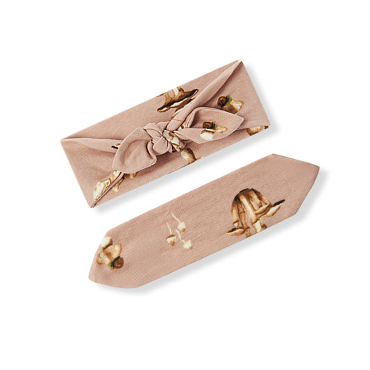 Organic cotton mushroom baby girl knotted bow headband, pink fabric shown from both sides with knot and flat design