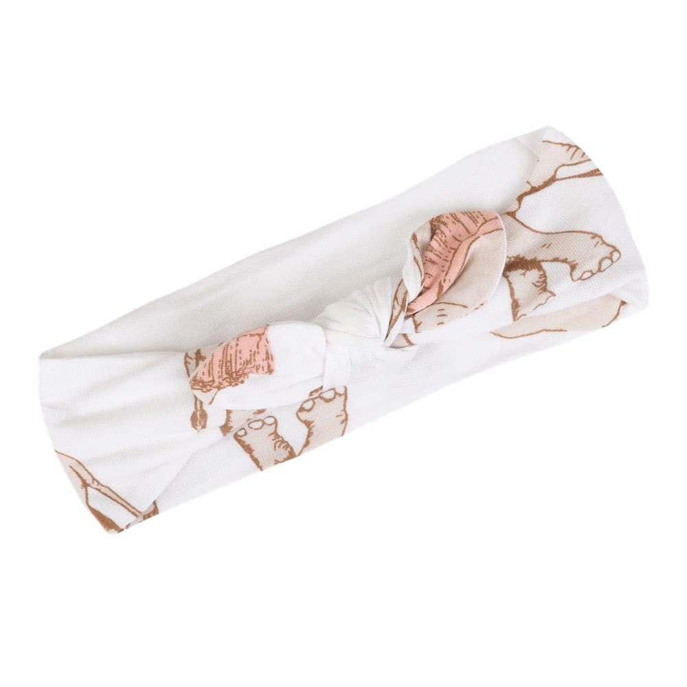 Baby girl bamboo knotted bow headband, white fabric with pinkish-gray elephants wearing tutus