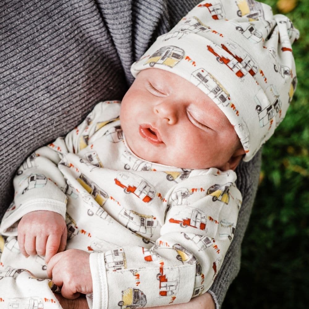 Baby Wearing the Vintage Trailers Organic Knotted Beanie Hat by Milkbarn