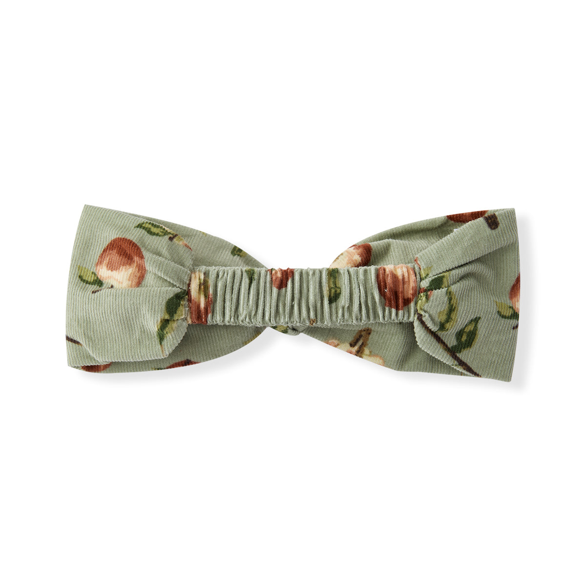 Baby girl corduroy headband with green and red apple print, showing stretchy elastic back for comfort