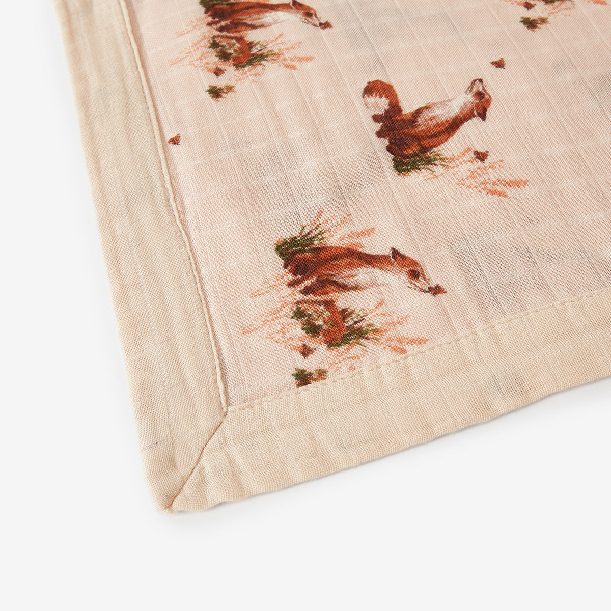 Closeup of Floral Fox Mini Lovey muslin fox and floral fabric in pink