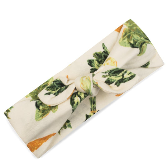 Organic cotton fresh veggies baby girl knotted bow headband, cream fabric with carrots, bok choy, and garden vegetable print