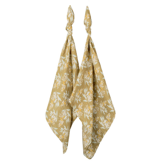 Two-piece organic cotton muslin baby burp cloth set with gold, yellow, and white floral design, soft and absorbent for newborns, perfect for baby gifts