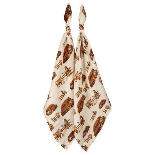 Two-piece organic cotton muslin baby burp cloth set with cream, red, and brown farm animal prints, featuring cows, horses, and pigs, ideal for newborns and baby shower gifts