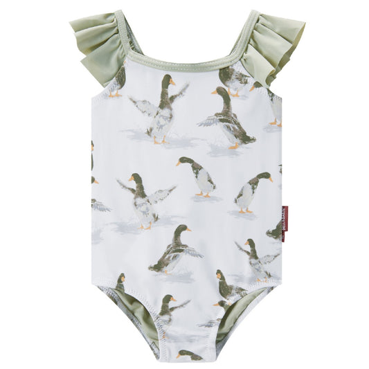 Front view of Milkbarn’s Duck Ruffled Cross Back Swimsuit highlighting cheerful yellow ducks on a soft neutral background with UPF 50+ nylon spandex blend