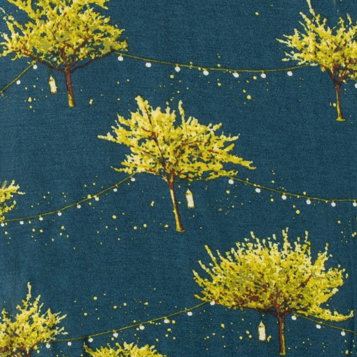 Closeup of print on Milkbarn Firefly Bamboo Dress and Legging Set, showing dark blue 100% rayon from bamboo fabric with whimsical glowing fireflies and light green trees for a magical nature-inspired look