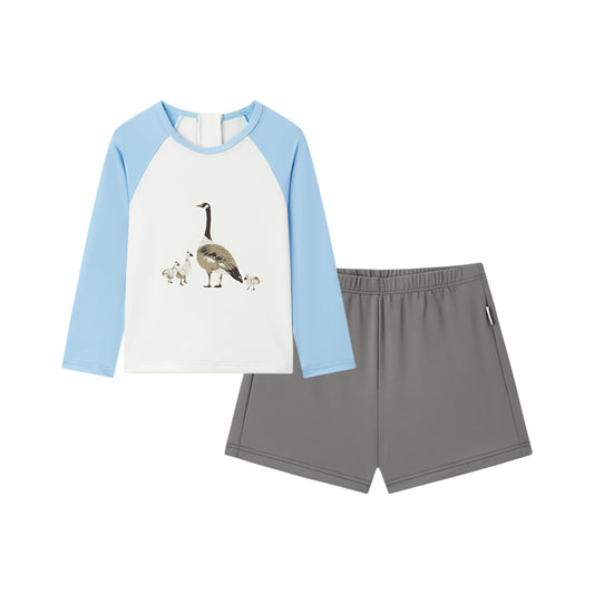 Front view of Milkbarn Swimming Goose long-sleeve shirt and trunks swim set for babies and toddlers, white shirt with blue sleeves and goose print, UPF 50+