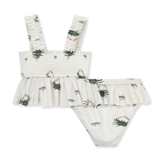 Milkbarn Coastal Crab ruffle two-piece swimsuit for baby girls with playful sea-green crabs on white, UPF 50+ protection and soft spandex comfort.