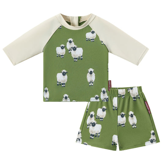 Front view of Milkbarn Valais Sheep short-sleeve swim top and trunks set for babies and toddlers, sheep print body with pale sleeves, UPF 50+ back-zip swim top.