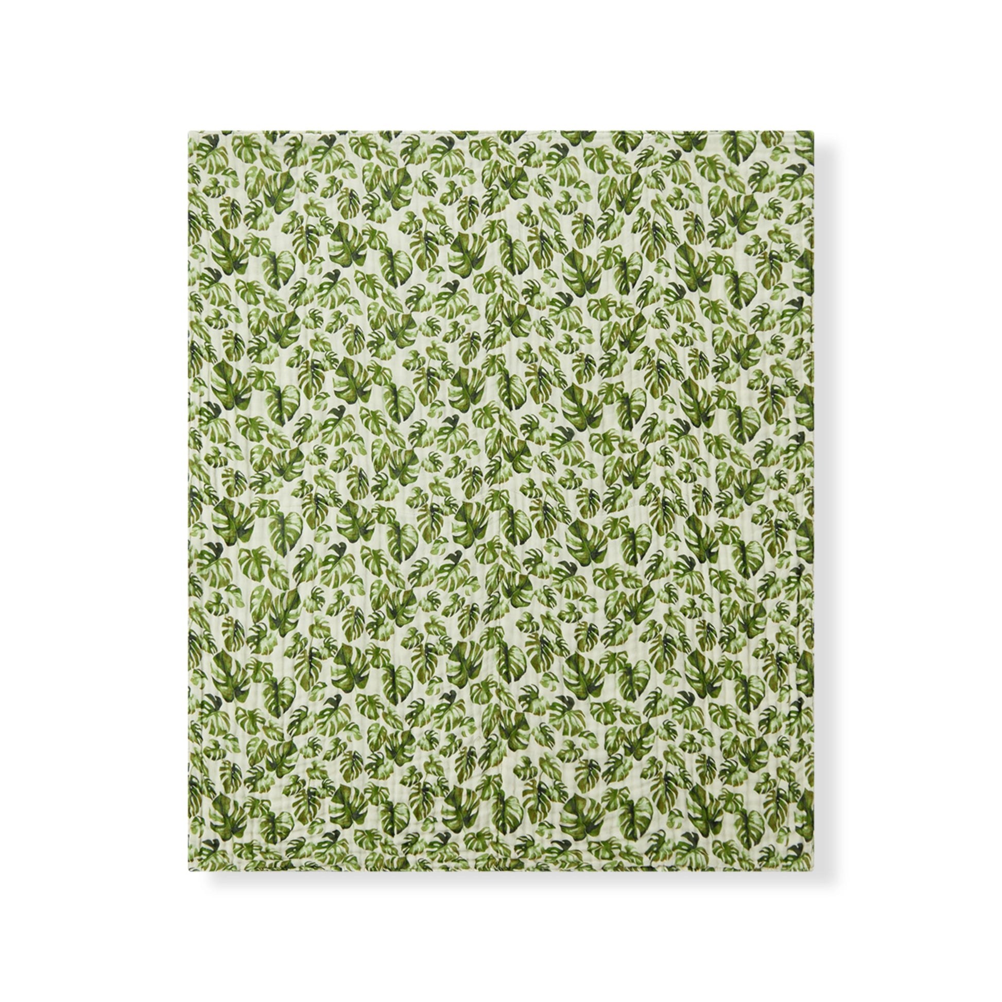 Milkbarn Island Leaf organic cotton baby towel with tropical leaf design, cozy and gentle for beach days or bedtime baths.
