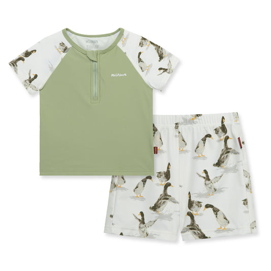 Front view of Milkbarn Duck zipper swim top and trunks set for babies and toddlers, green body with cheerful duck print sleeves, UPF 50+ sun-protective swimwear.