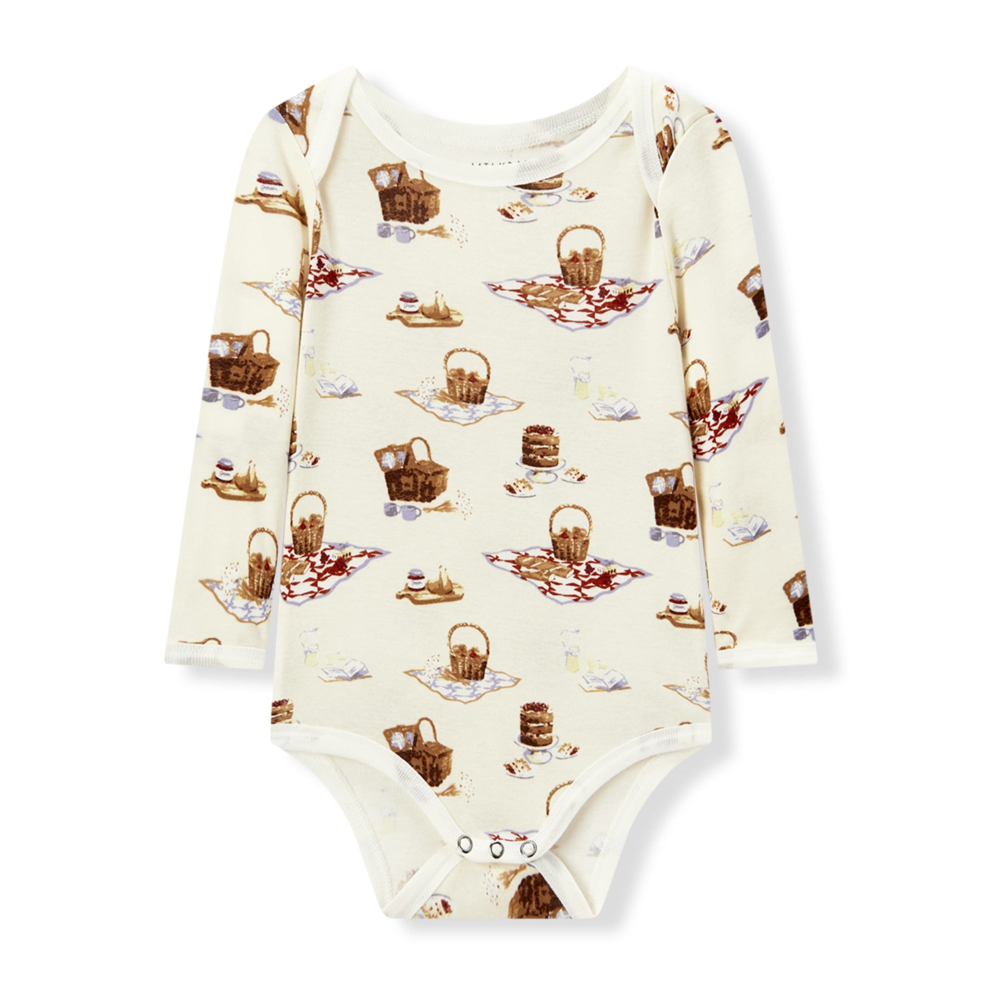 Soft and hypoallergenic organic cotton long sleeve baby one piece in white with playful picnic print