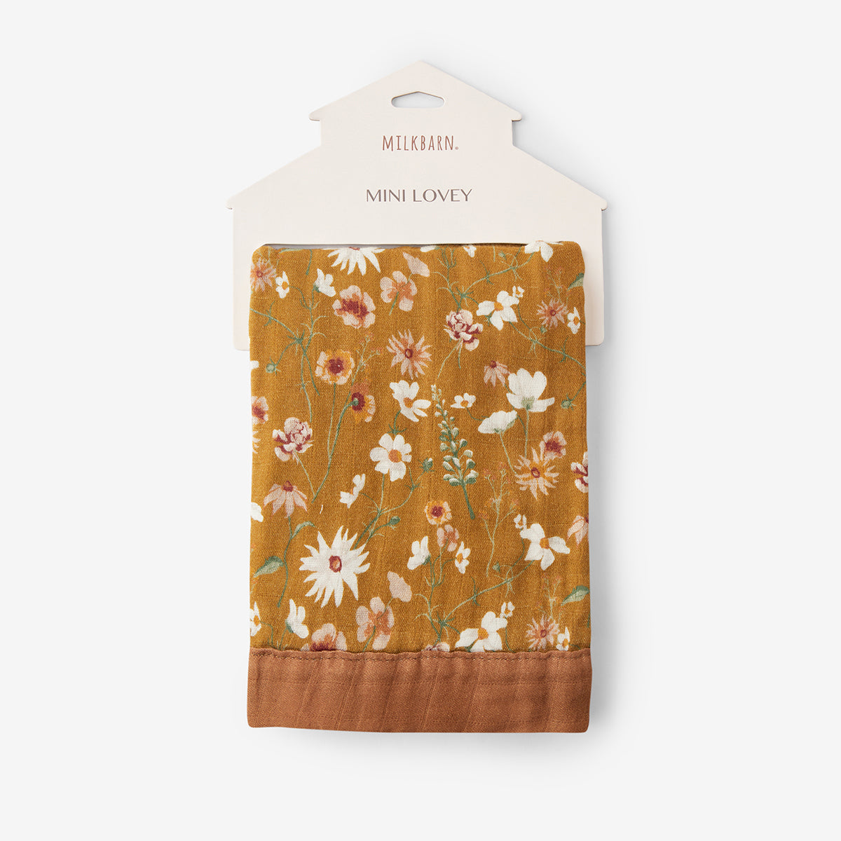 Close-up of Wildflower Bamboo Mini Lovey muslin fabric showing delicate floral details, orangey brown base, and soft trim for little girls