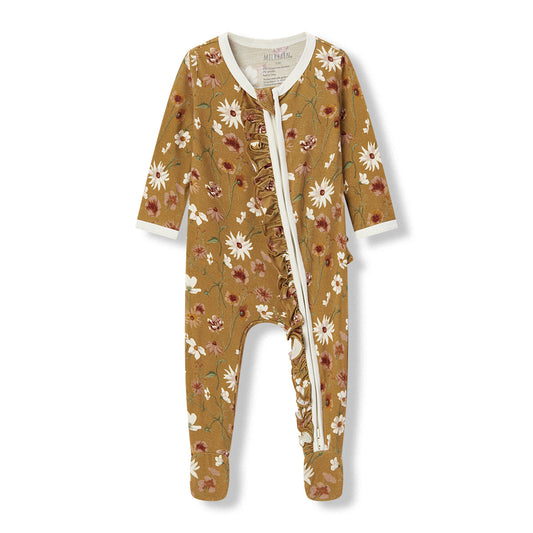 Milkbarn Wildflower Luxe Stretch Ruffle Footed Pajamas for baby girls in brown and white, made of soft and breathable bamboo blend with playful wildflower pattern, gentle on skin and comfortable for sleep and play