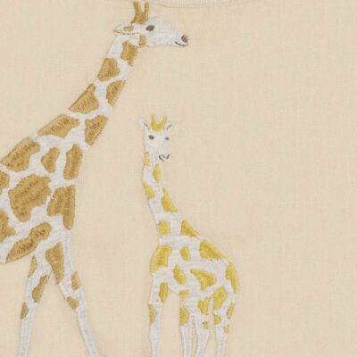 Milkbarn Kids Applique Detail of the Giraffe Applique on the organic Linen Bib