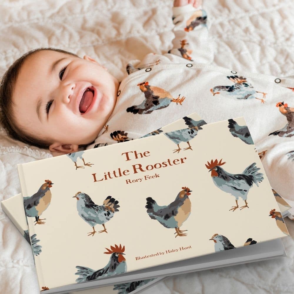 The Little Rooster by Rory Feek with Baby Wearing Matching Organic Cotton Chicken Print Footed Romper by Milkbarn Kids