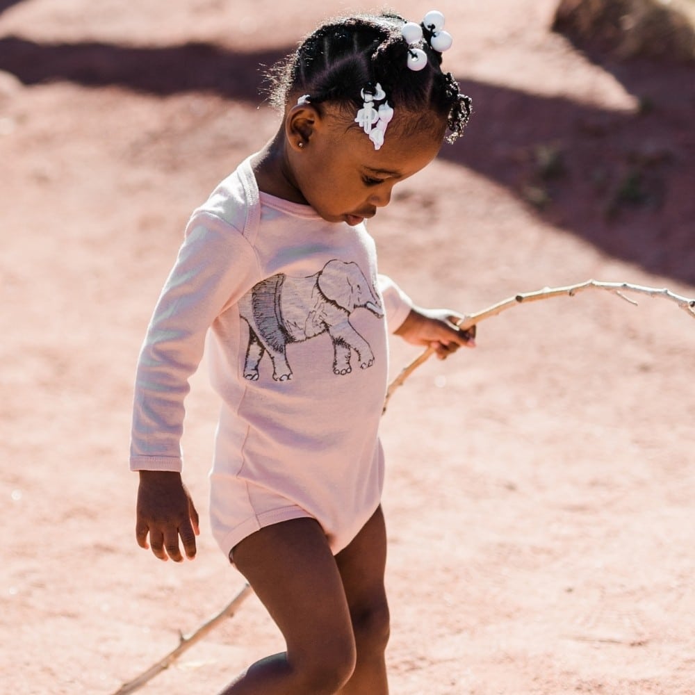 Little Girl with a stick walking in the Tutu Elephant Applique Long Sleeve One Piece by Milkbarn Kids