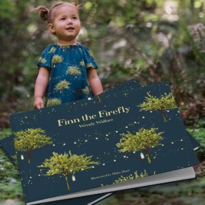 Baby girl in a green forest with fireflies with matching book Finn the Firefly by Wendy Wallace for Milkbarn