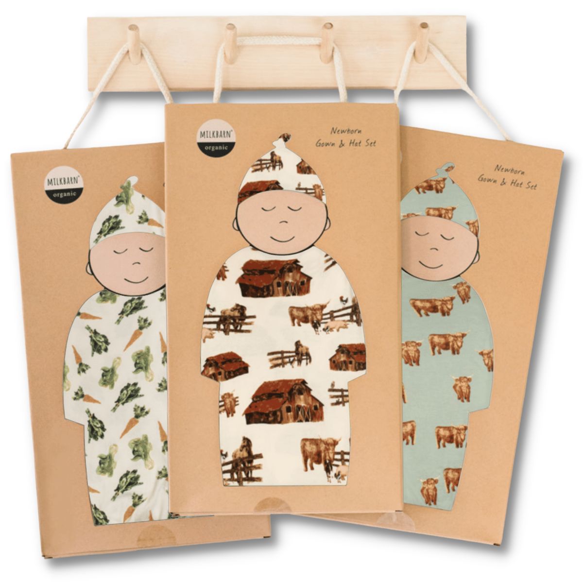 Newborn Organic and Bamboo Gown and Hat Set Packaging Display in the Homestead print, the Fresh Veggies print, and the Highland Cow by Milkbarn