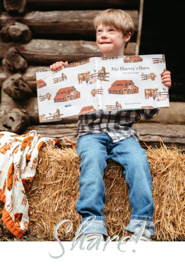 A boy sits on a bale of hay on a far holding the children's book, Mr. Harvey's Barn by Tina Yawn Seago with Illustrations by Haley Hunt for Milkbarn Kids